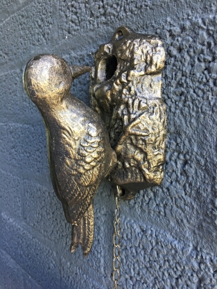 Beautiful distinct door knocker, woodpecker in bronze color, metal.